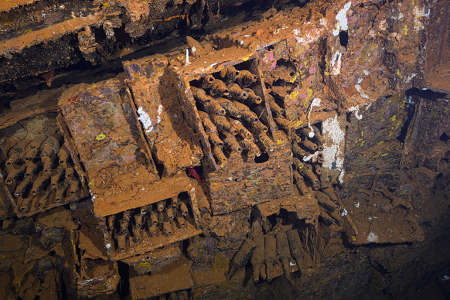 3/4/2023<br>This hold has lots of sake bottles still in crates, though now tipped on their side as the ship is resting on its side.